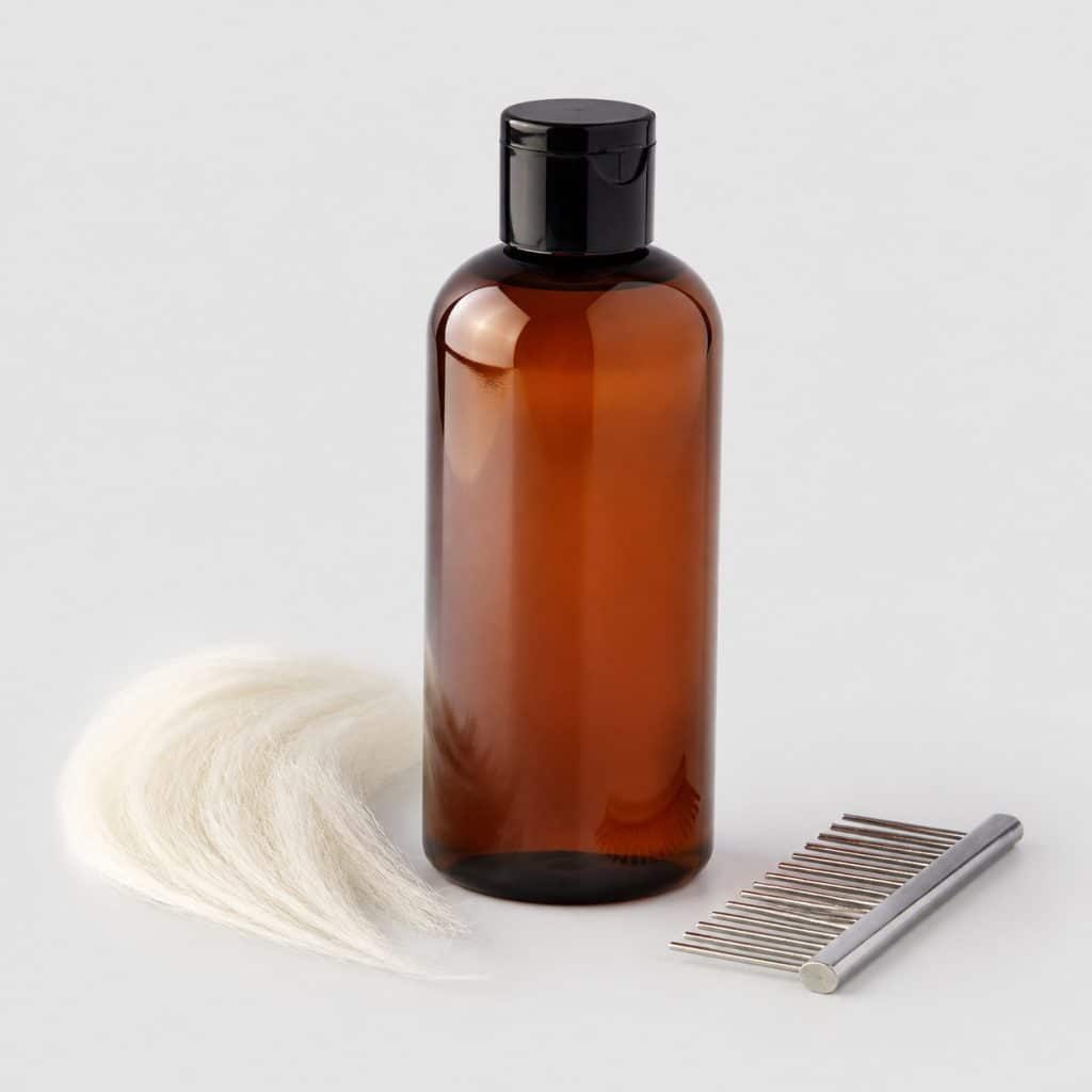 Flacon de shampooing démêlant 400 ml et peigne à dents larges