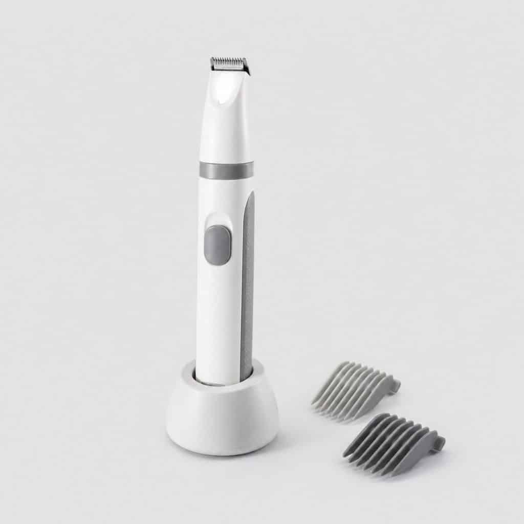 Tondeuse de finition sans fil au format stylo avec son socle et ses peignes